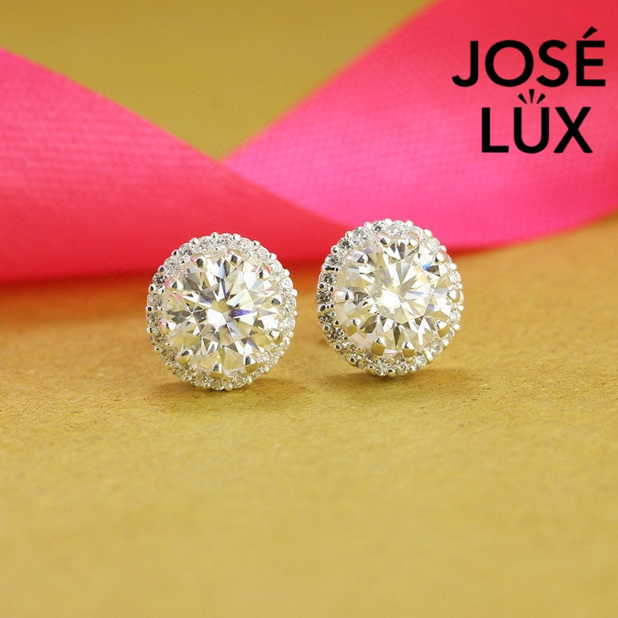 Regal crown-inspired moissanite with sparkling halo setting in sterling silver. Majestic design delivers brilliant fire and exceptional clarity for sophisticated everyday elegance.