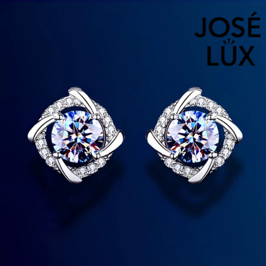 Brilliant cushion-cut moissanite with sparkling halo setting in sterling silver. Timeless elegance and exceptional fire make these studs perfect for everyday sophistication.