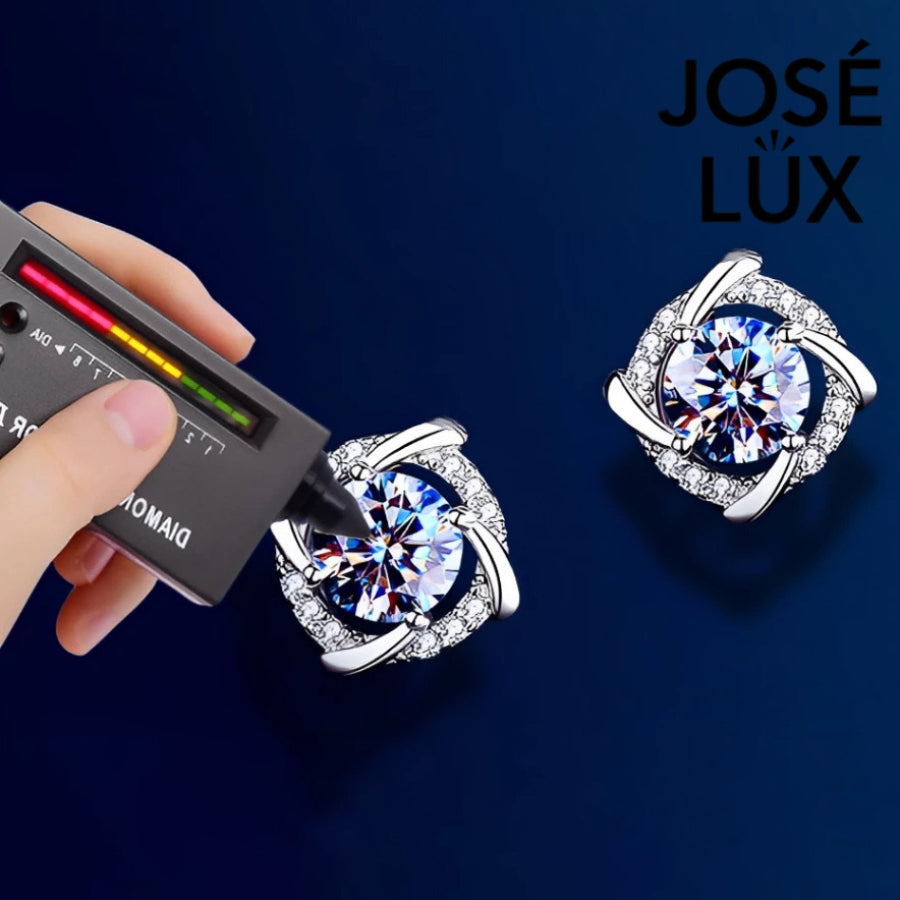 Brilliant cushion-cut moissanite with sparkling halo setting in sterling silver. Timeless elegance and exceptional fire make these studs perfect for everyday sophistication.