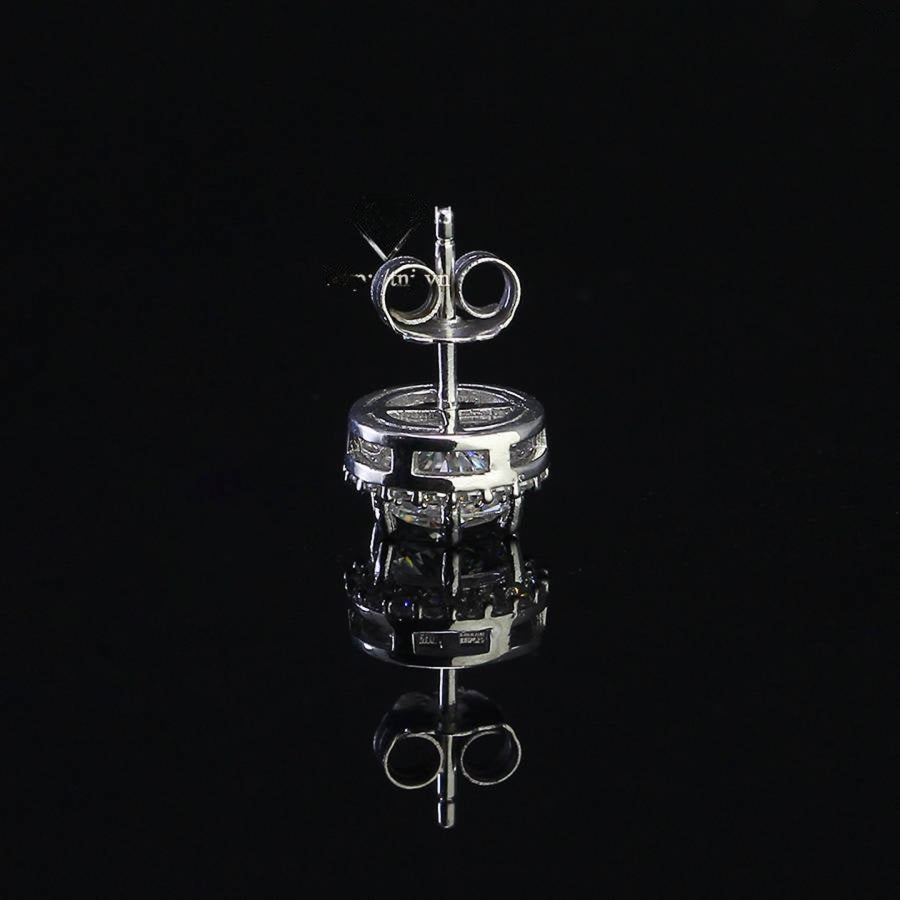 Sterling silver halo studs with 0.8ct round moissanite. Classic design features a brilliant center stone surrounded by smaller accents with secure push-back posts for everyday elegance