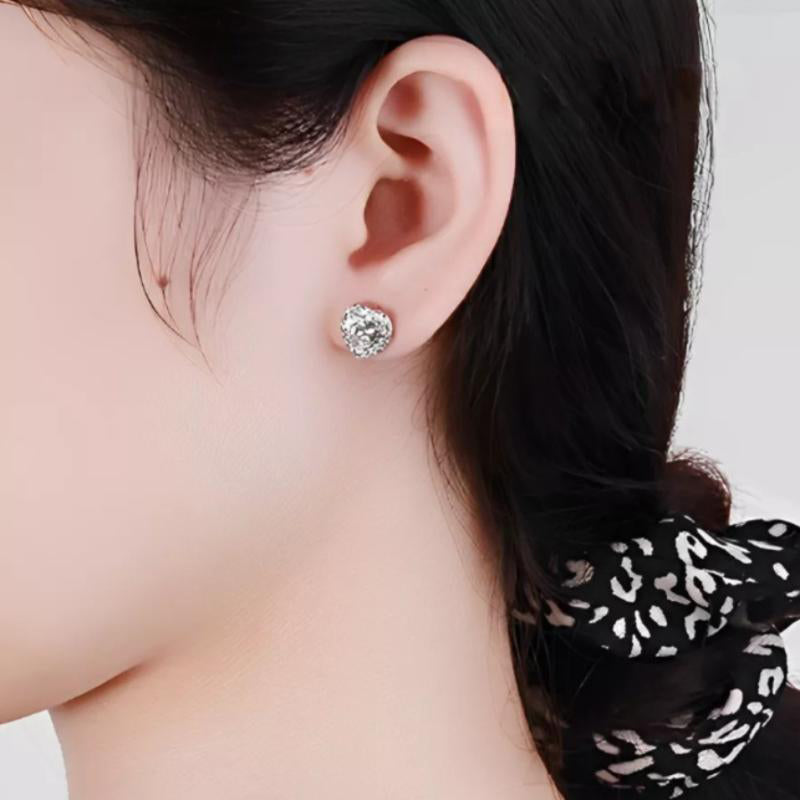 Elegant heart-shaped moissanite earrings with sparkling halo setting in sterling silver. Perfect for daily wear or special occasions with brilliant fire and exceptional clarity.