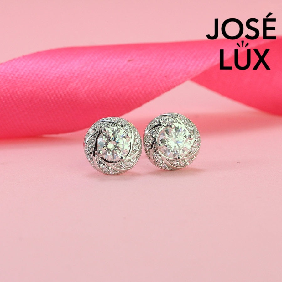 Elegant spiral halo moissanite with sparkling setting in sterling silver. Dynamic swirl design delivers brilliant fire and scintillation for sophisticated everyday elegance.