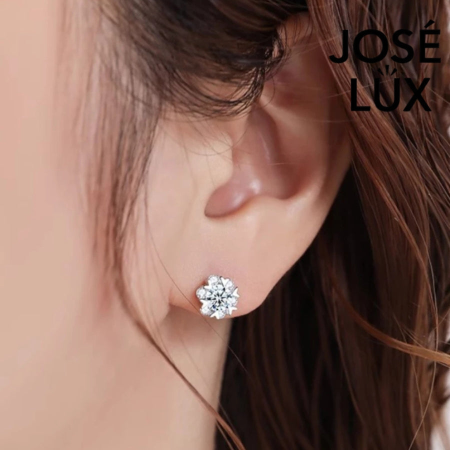 Radiant star-shaped moissanite with sparkling halo setting in sterling silver. Celestial-inspired design delivers brilliant fire and scintillation for sophisticated everyday glamour.