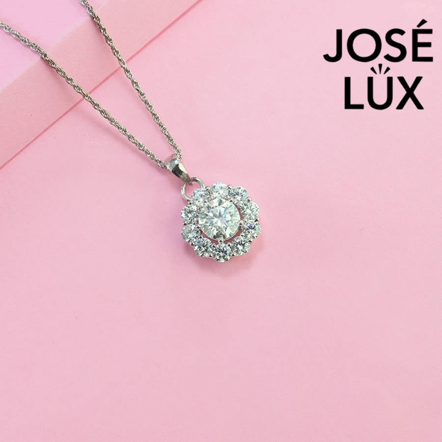 Timeless round moissanite pendant surrounded by scalloped halo design creates vintage-inspired elegance, expertly handcrafted in lustrous sterling silver for lasting beauty.