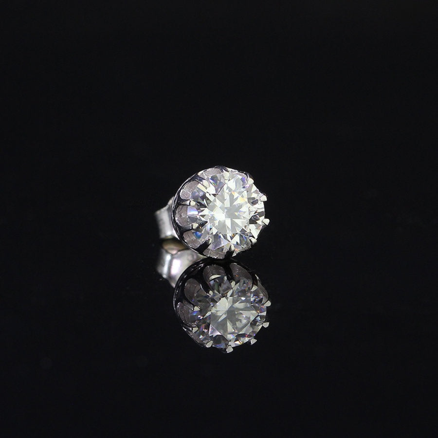 Single round moissanite stud earring for men in sterling silver, 0.8ct, displayed on reflective black background for jewelry detail.