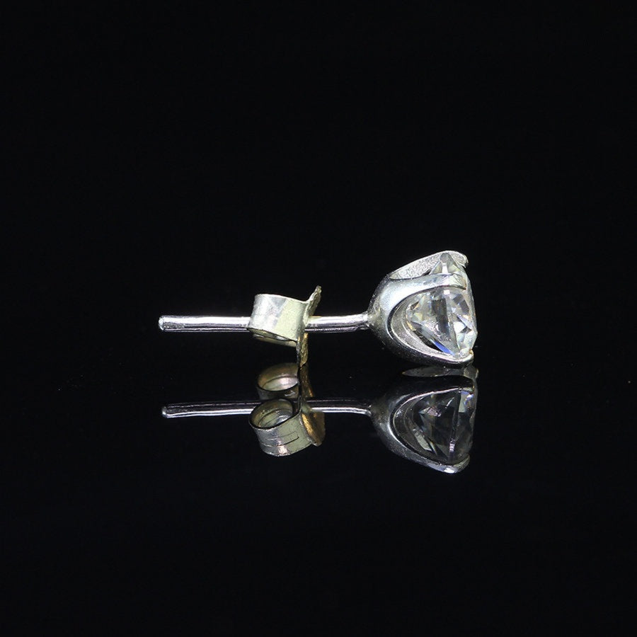 Horizontal view of Round Moissanite Stud Earring for Men, 0.8ct stone in sterling silver with secure 4-prong setting.