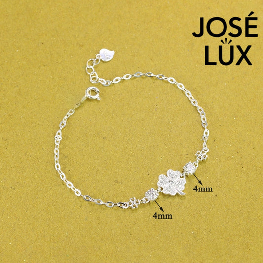 Star clover station moissanite bracelet in sterling silver showcases pave-set four-leaf clover centerpiece with brilliant stones totaling 0.6 carats on cable chain.