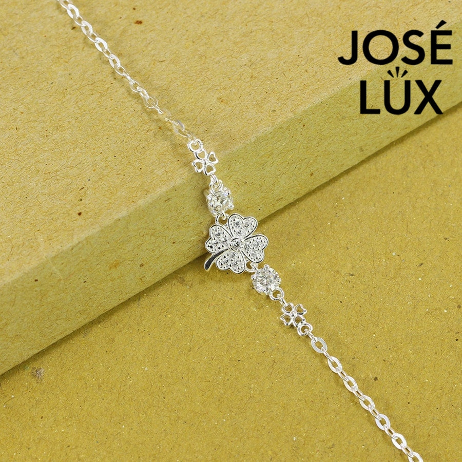 Star clover station moissanite bracelet in sterling silver showcases pave-set four-leaf clover centerpiece with brilliant stones totaling 0.6 carats on cable chain.