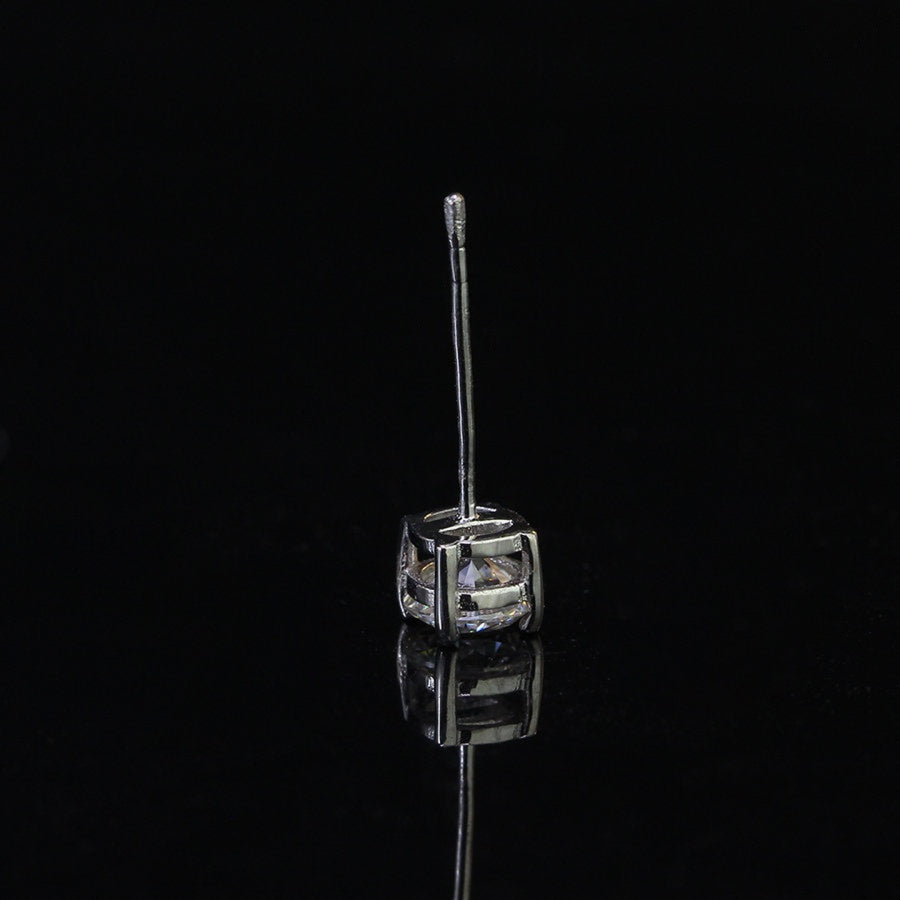 Sterling silver round moissanite stud earring for men with 0.5ct brilliant-cut stone in a classic basket setting and push-back post.