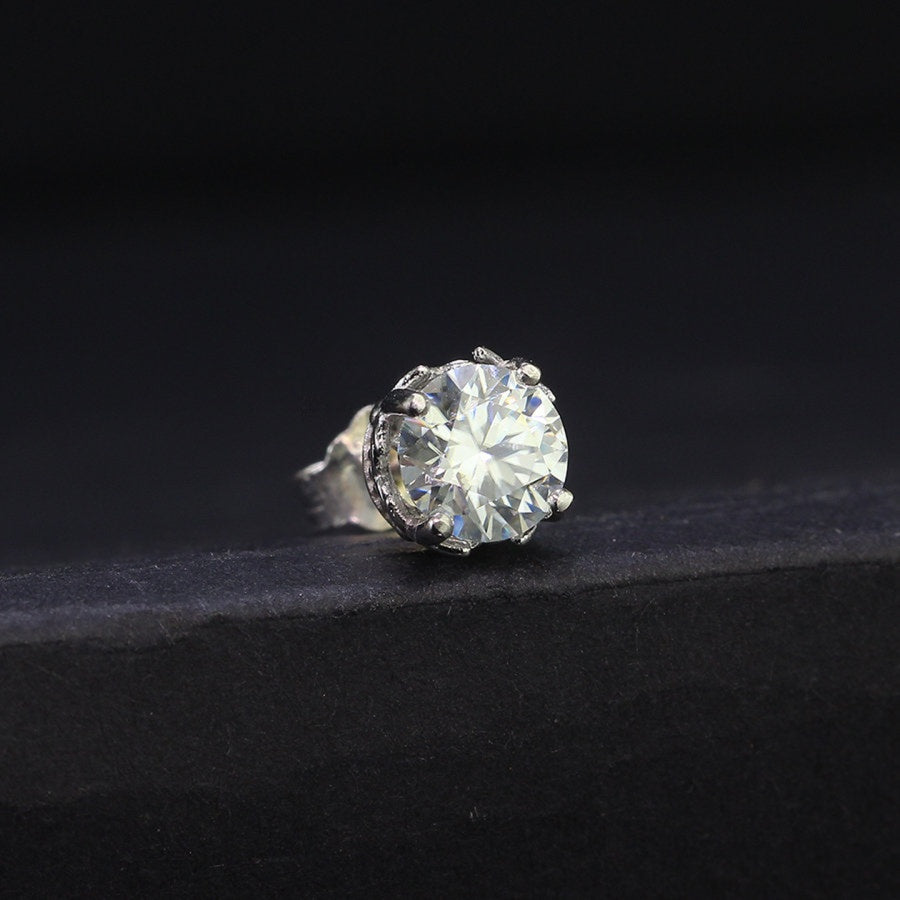 Vintage crown moissanite stud earring for men in sterling silver with 0.8ct GRA certified stone, shown on a dark display surface.