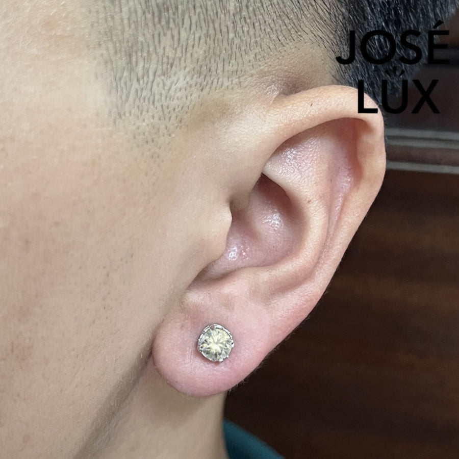 Sterling silver vintage crown moissanite stud earring worn by a man, showcasing 0.8ct GRA certified brilliance and secure fit.