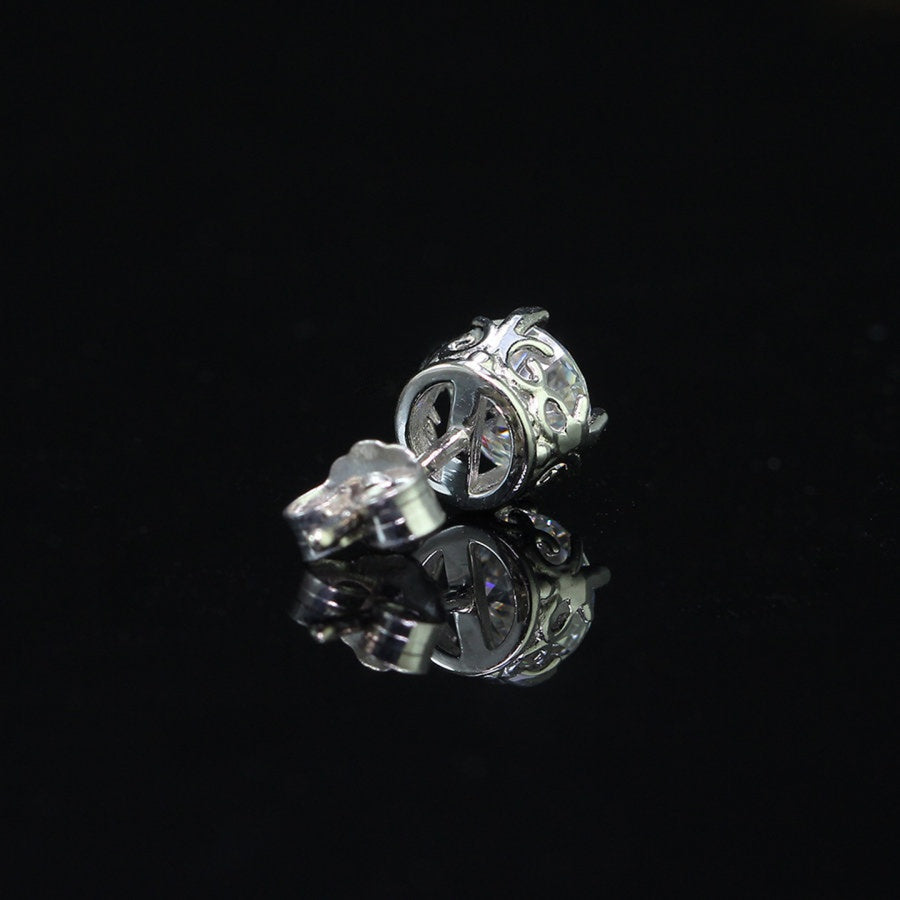 Detailed bottom view of men's vintage crown moissanite stud earring in sterling silver, highlighting intricate crown design.