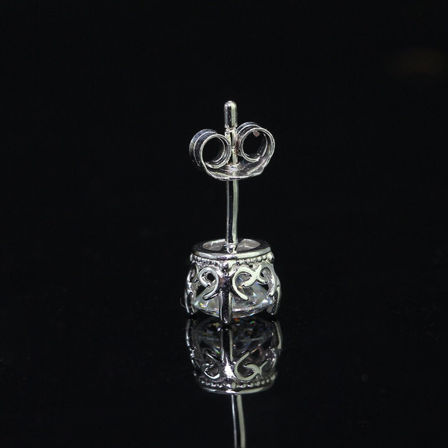 Rear view of vintage crown moissanite stud earring for men, showcasing sterling silver scrollwork and secure post backing.