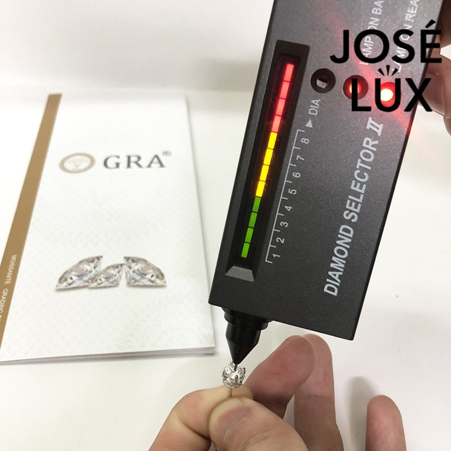 Moissanite stud earring for men being tested with diamond selector, confirming authenticity of 0.8ct GRA certified stone.